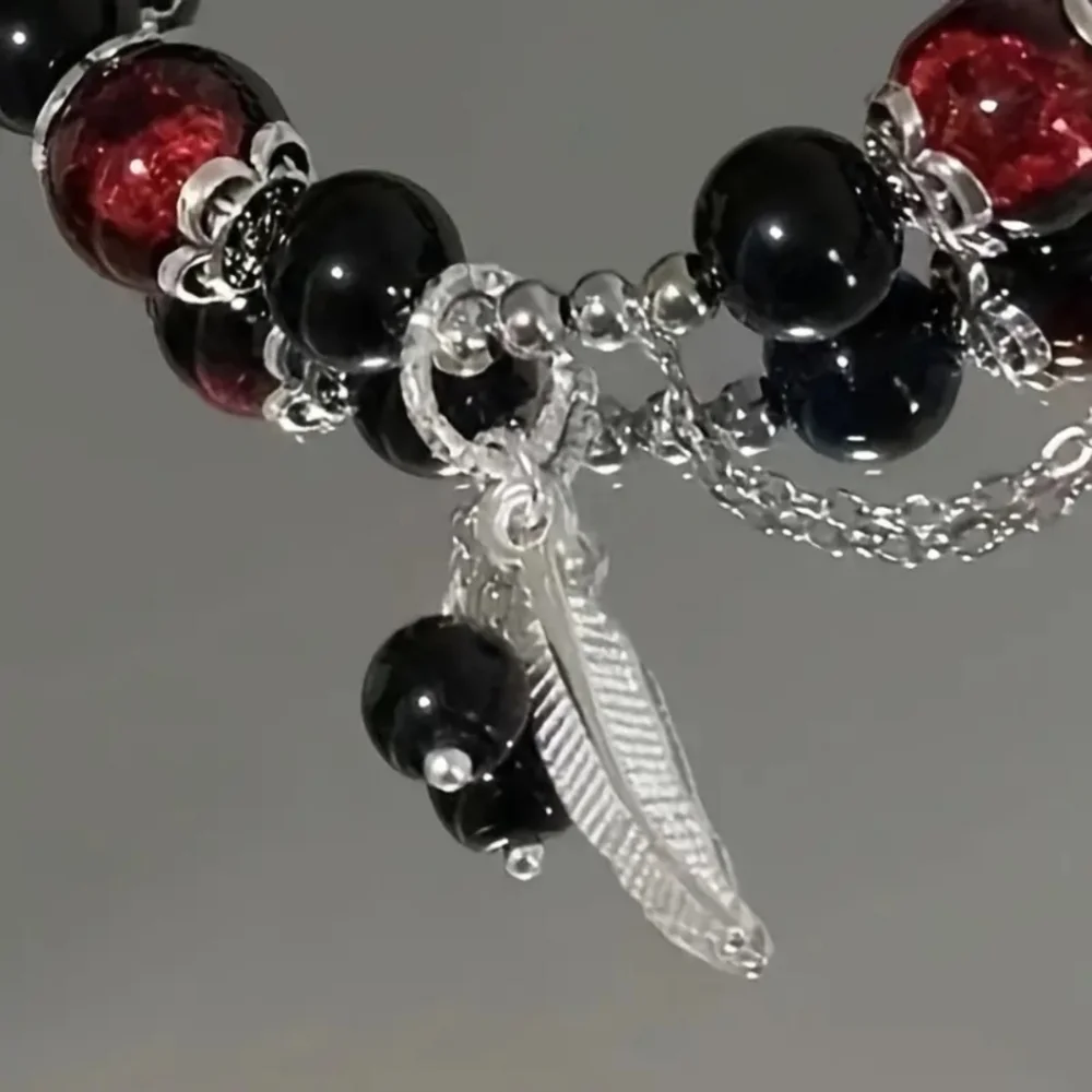 Black and Red Beaded Elastic Bracelet with Silver‎ Charms